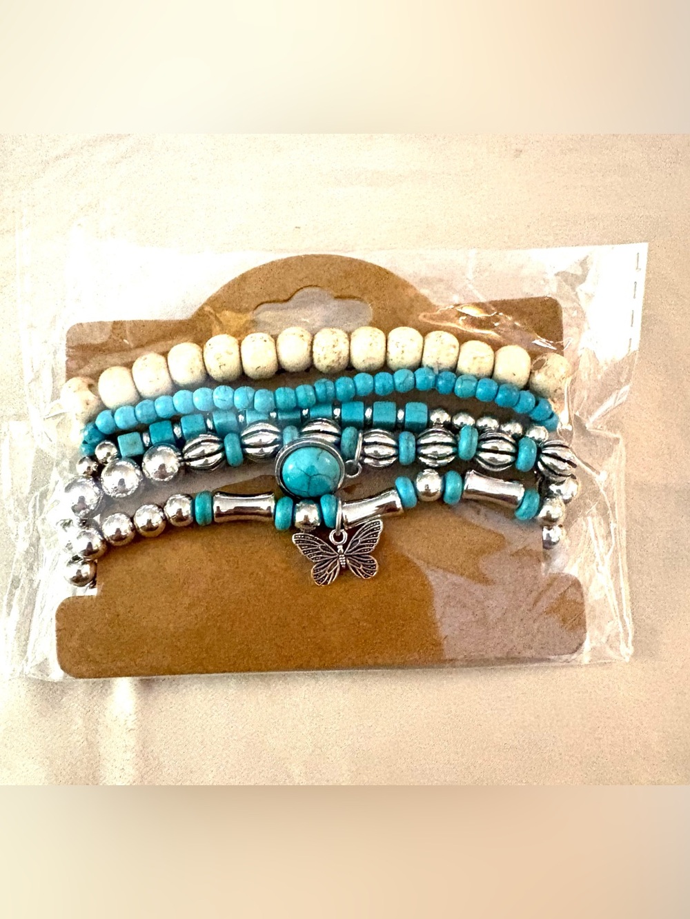 Turquoise & Cream Beaded Bracelet Set with Silver Butterfly Charm. NWT.